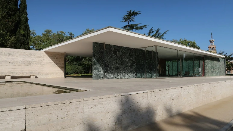 Sleek modern pavilion with flat roof and green marble walls.